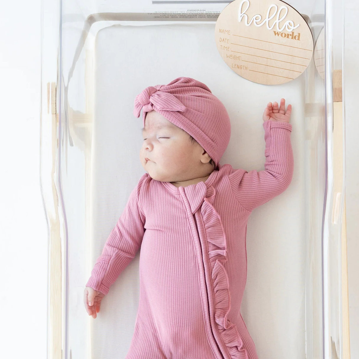 Kyte Baby Ribbed Ruffle Zipper Footie - Apple Blossom