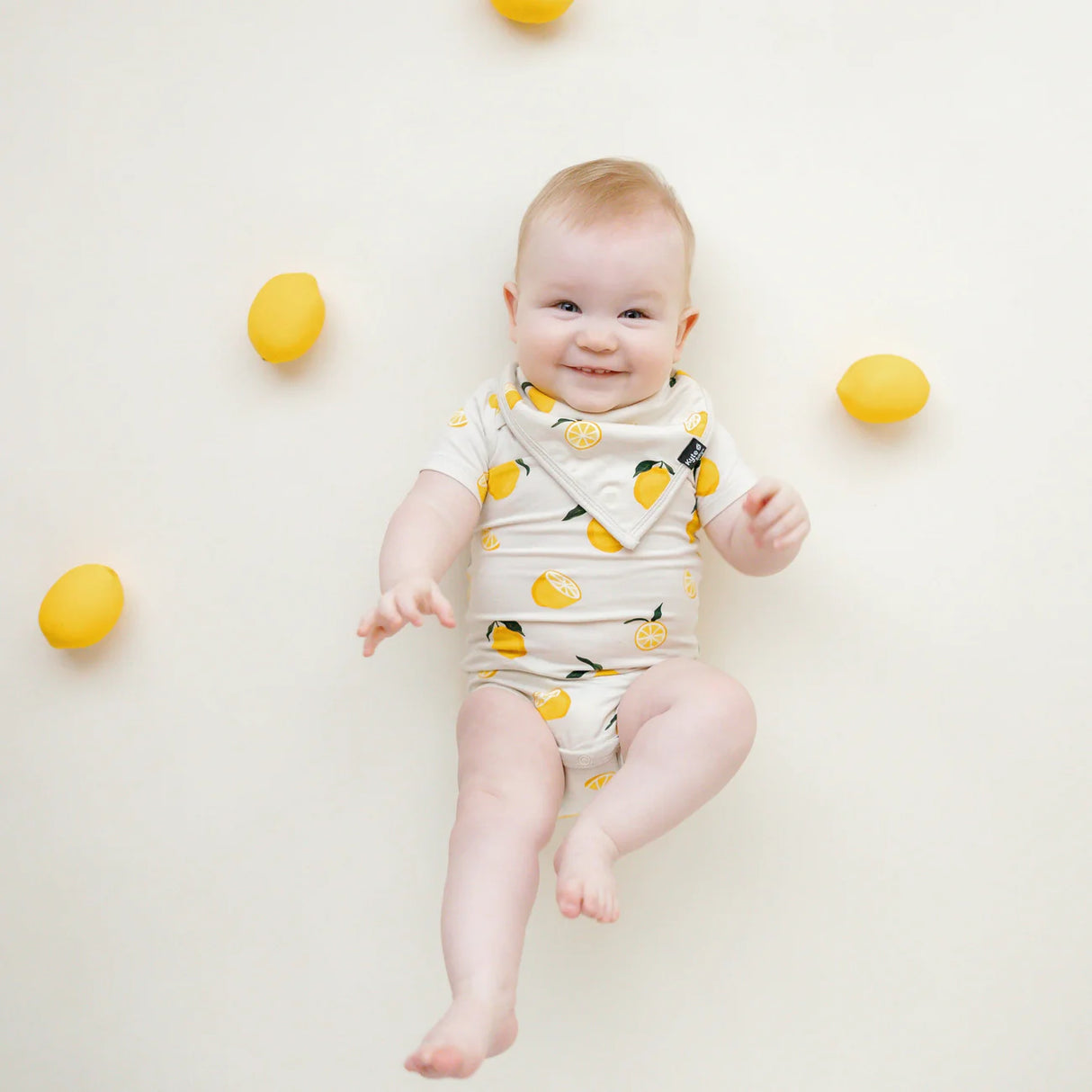 Kyte Baby Bodysuit in Lemon